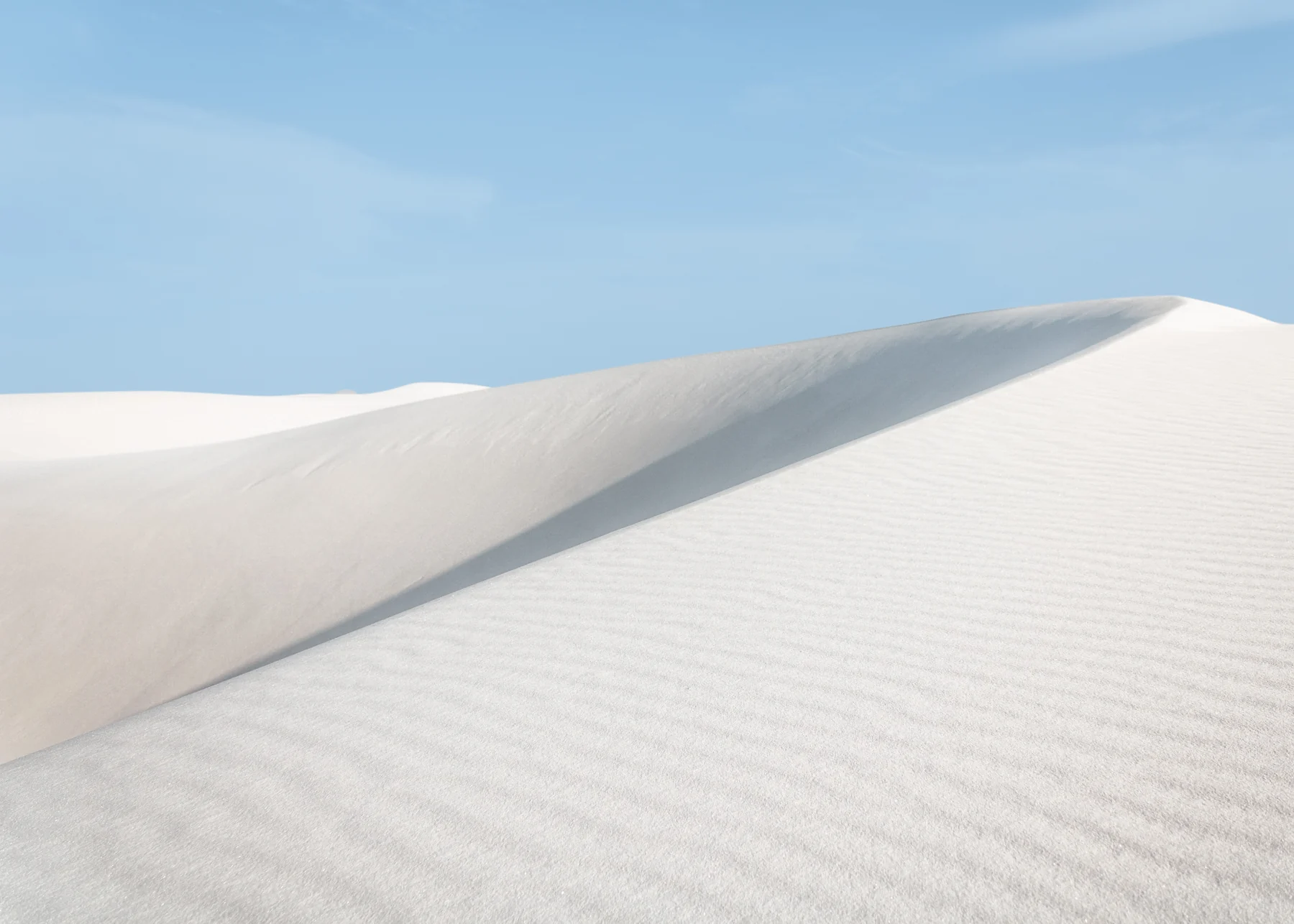Soft contours of white sand dunes